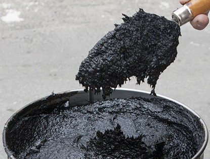 Bucket of Tar Coating